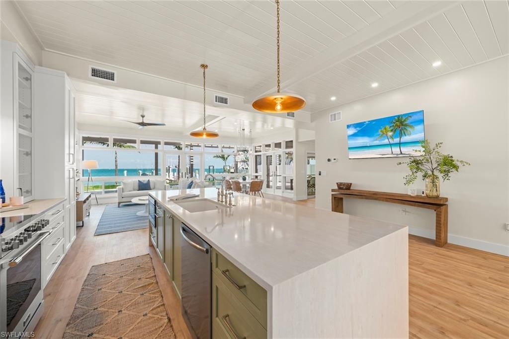 Dining room, Interior, Kitchen, Pendant Lights, Recessed Lighting, Stainless Steel Appliances, Water, Wood Texture Flooring