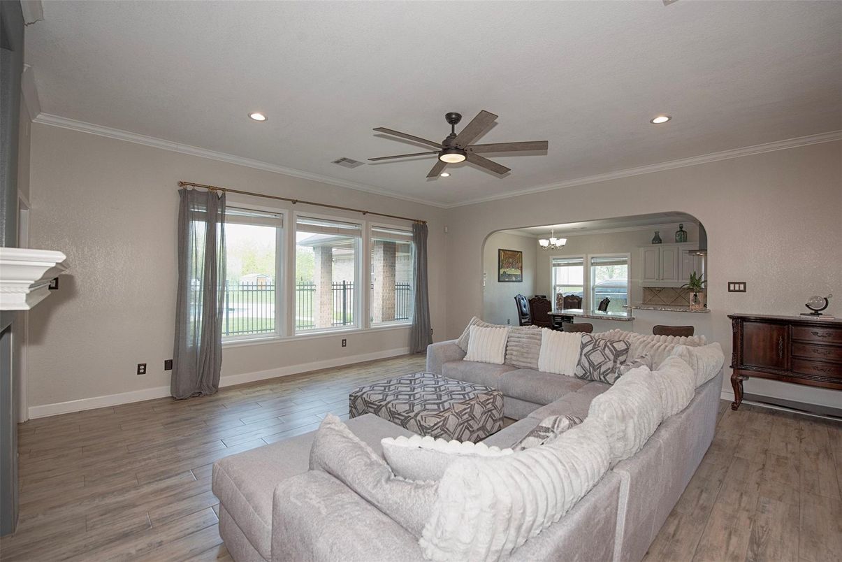 Dining room, Fireplace, Interior, Living room, Recessed Lighting, Wood Texture Flooring