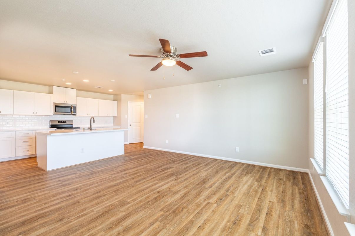 Empty room, Interior, Kitchen, Recessed Lighting, Stainless Steel Appliances, Wood Texture Flooring