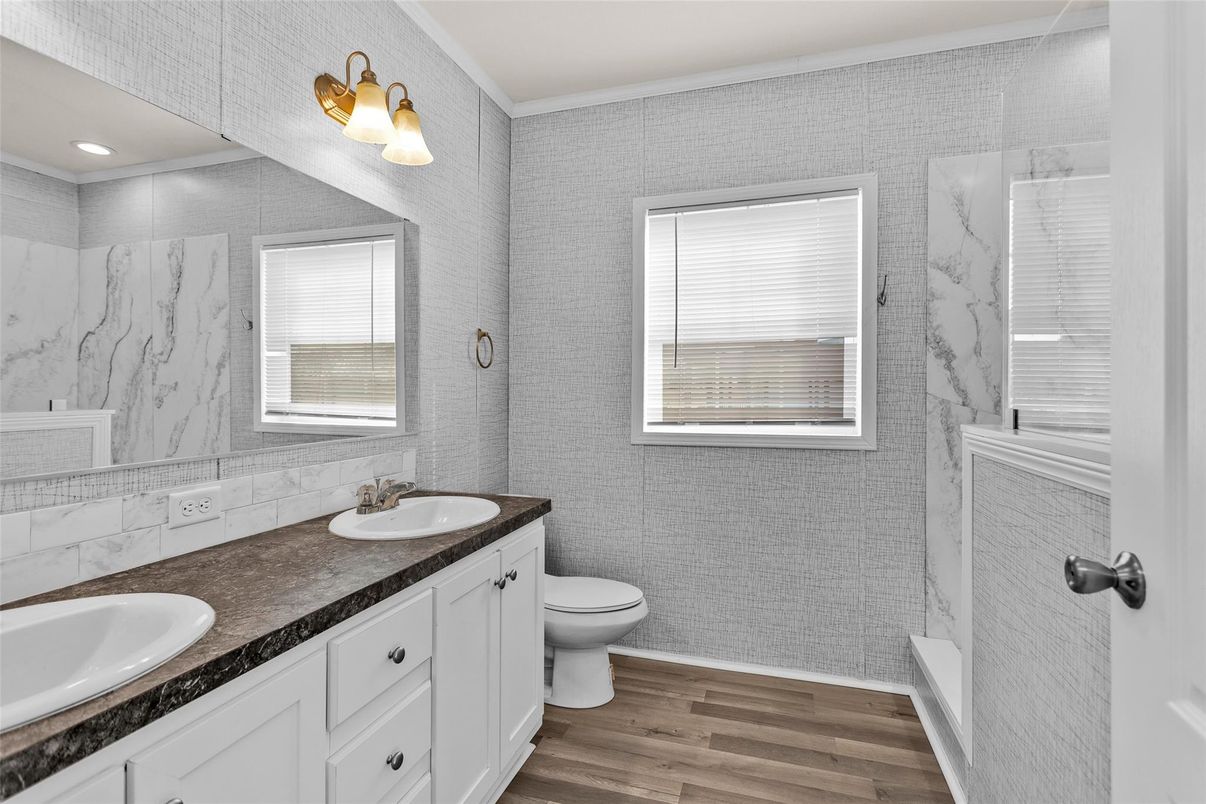 Bathroom, Dual Sink Vanities, Interior, Marble Walls, Recessed Lighting, Wood Texture Flooring