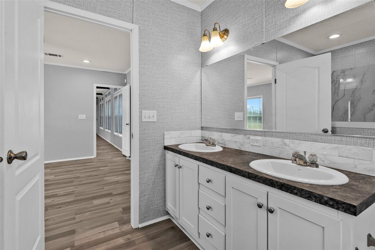 Bathroom, Dual Sink Vanities, Interior, Marble Walls, Recessed Lighting, Wood Texture Flooring