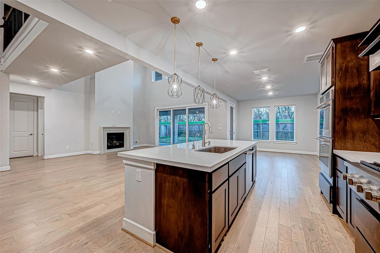 Fireplace, Interior, Kitchen, Pendant Lights, Recessed Lighting, Wood Texture Flooring