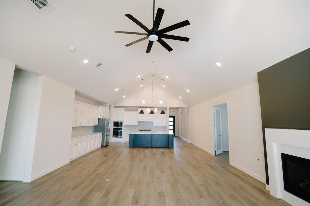 Empty room, Fireplace, Interior, Kitchen, Pendant Lights, Recessed Lighting, Wood Texture Flooring