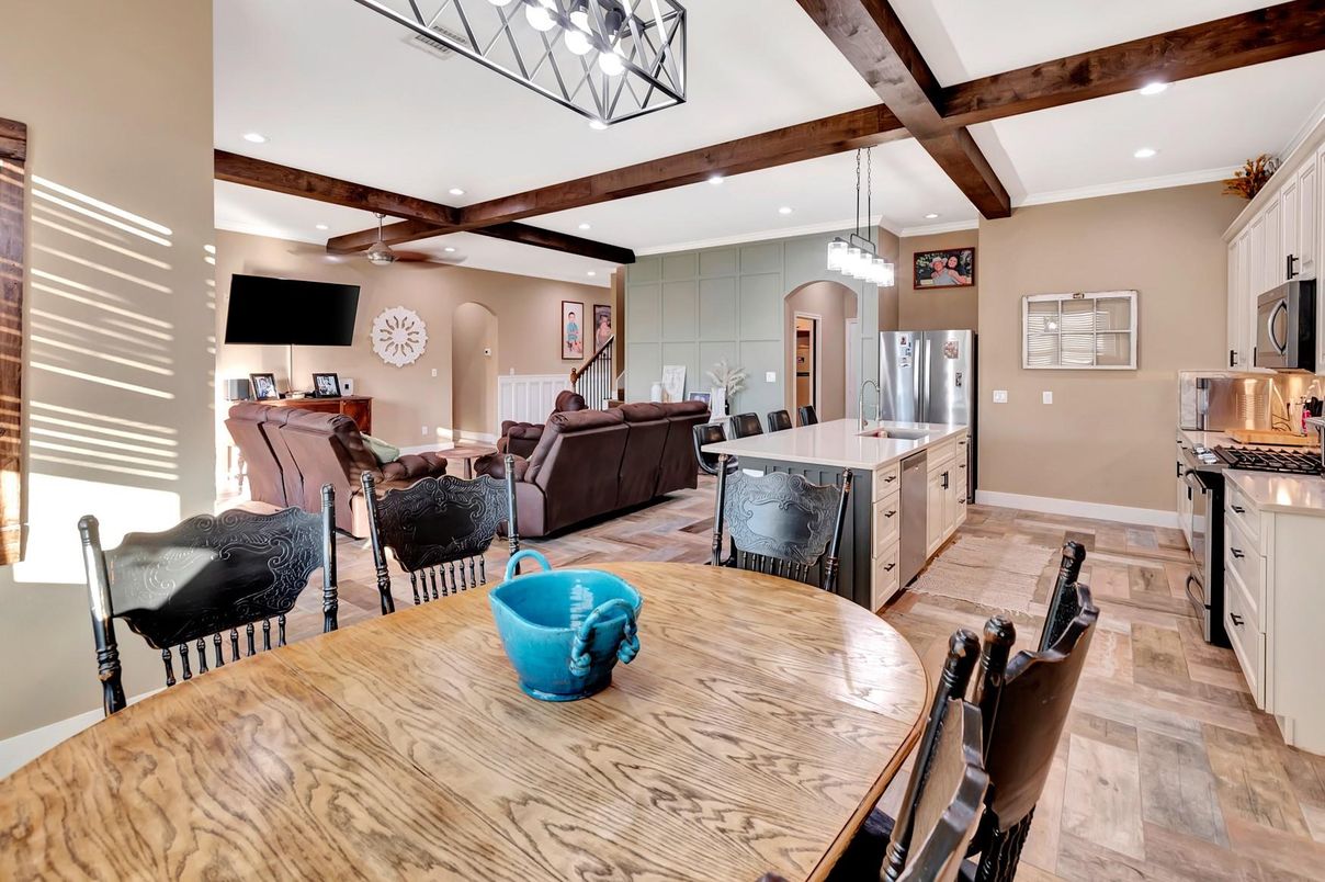 Dining room, Interior, Kitchen, Living room, Pendant Lights, Recessed Lighting, Stainless Steel Appliances, Wooden Beams, Wood Texture Flooring