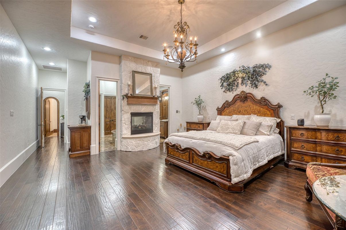 Bedroom, Chandelier, Fireplace, Interior, Recessed Lighting, Wood Texture Flooring