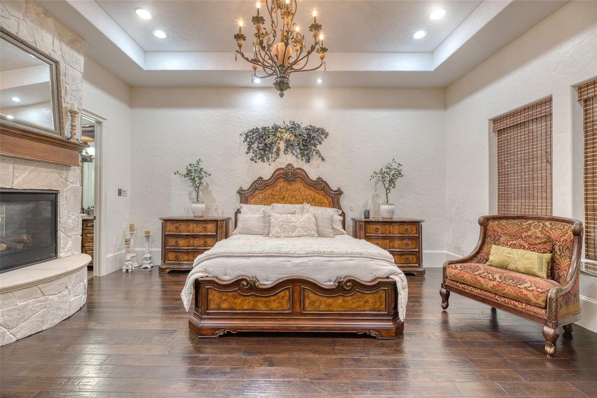 Bedroom, Chandelier, Fireplace, Interior, Recessed Lighting, Wood Texture Flooring