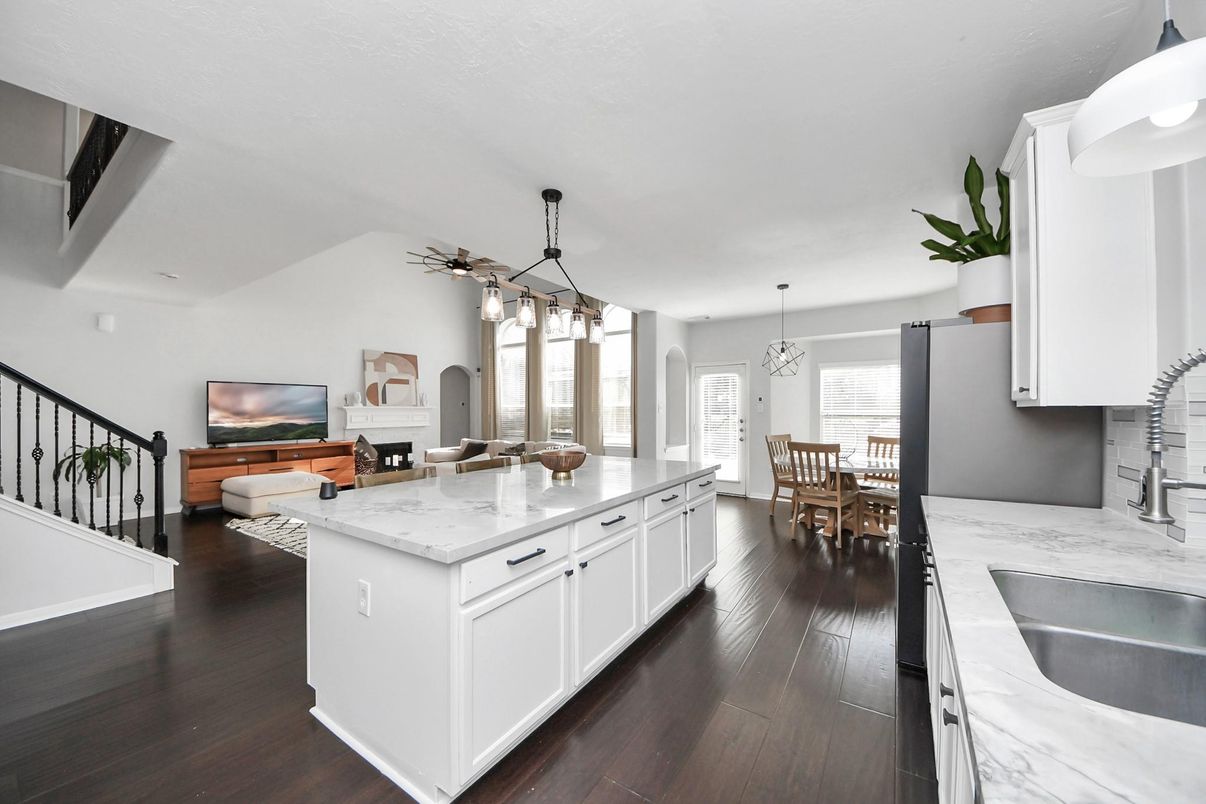 Chandelier, Dining room, Fireplace, Interior, Kitchen, Living room, Pendant Lights, Wood Texture Flooring