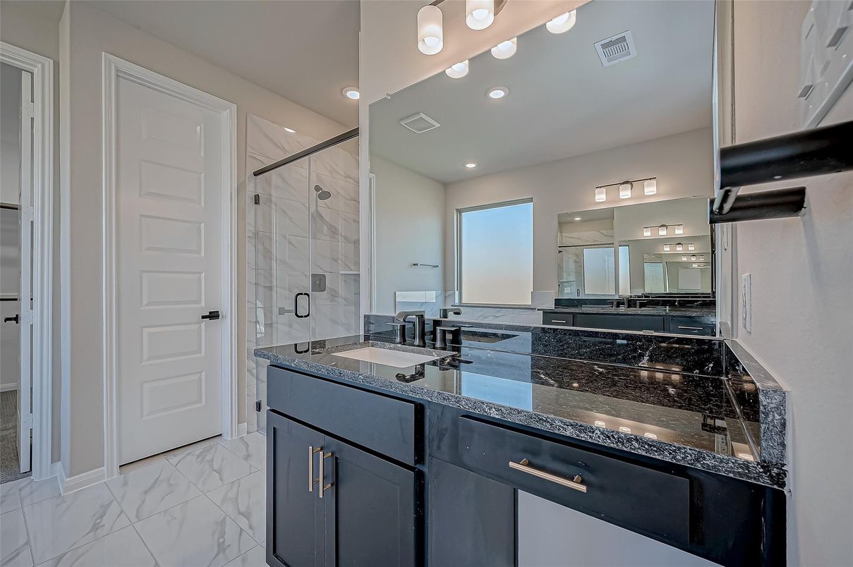 Bathroom, Dual Sink Vanities, Glass Shower, Interior, Marble, Marble Walls, Recessed Lighting