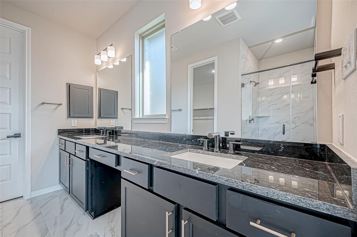 Bathroom, Dual Sink Vanities, Glass Shower, Interior, Marble, Marble Walls, Recessed Lighting
