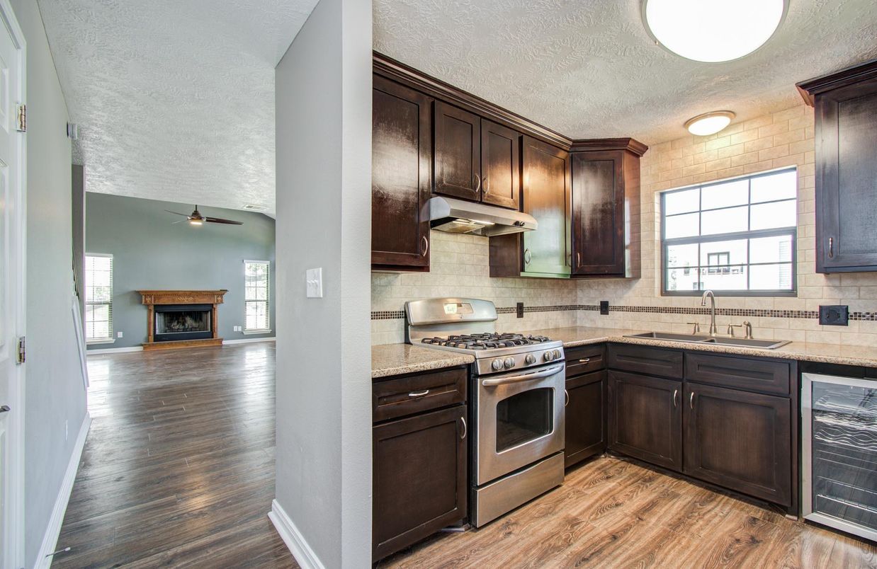Fireplace, Interior, Kitchen, Tile Countertops, Wood Texture Flooring