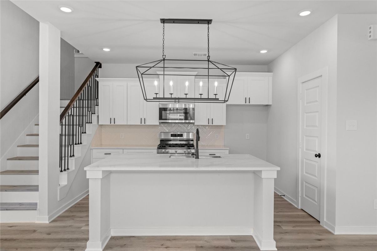 Interior, Kitchen, Pendant Lights, Recessed Lighting, Stainless Steel Appliances, Wood Texture Flooring