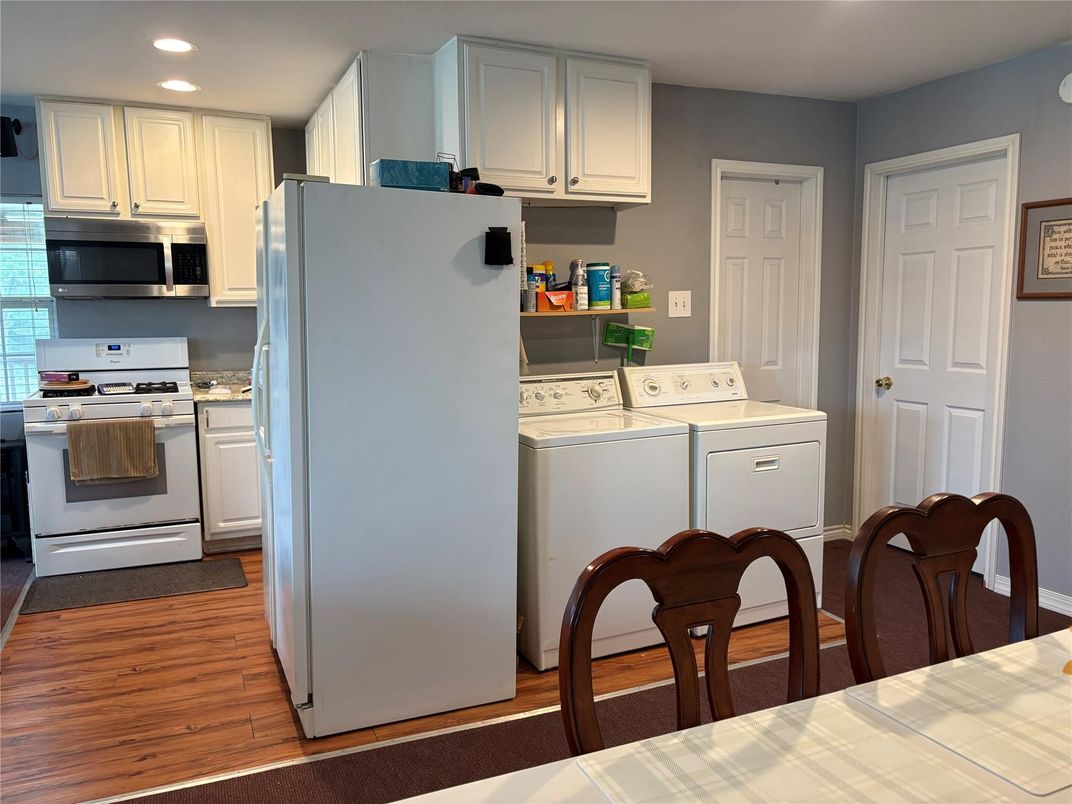 Interior, Kitchen, Recessed Lighting, Washer, Wood Texture Flooring