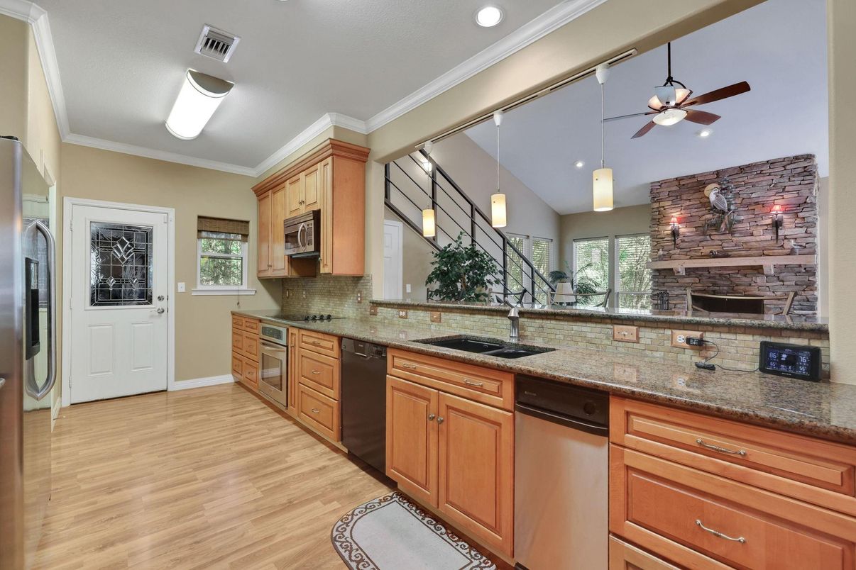 Fireplace, Interior, Kitchen, Pendant Lights, Recessed Lighting, Stone Walls, Wood Texture Flooring