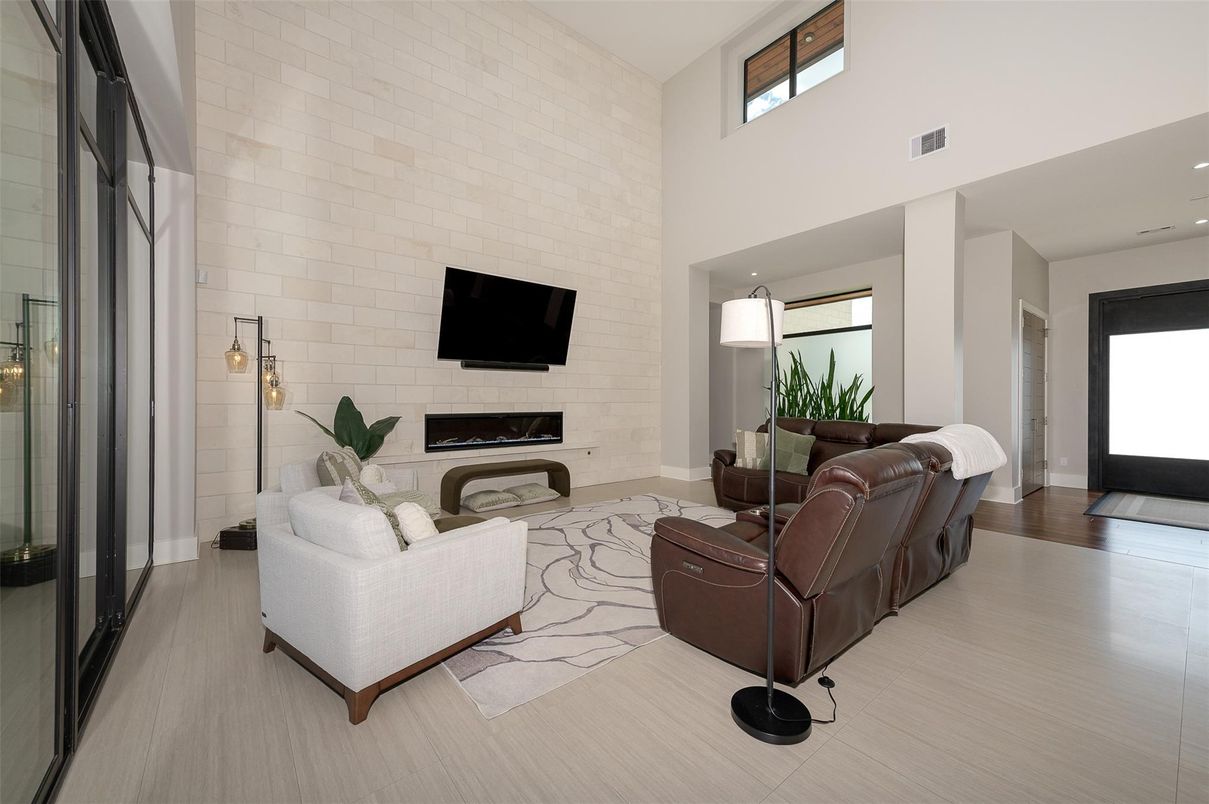 Fireplace, Interior, Living room, Recessed Lighting, Stone Walls, Wood Texture Flooring