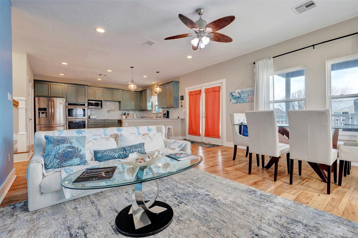 Dining room, Interior, Kitchen, Living room, Pendant Lights, Recessed Lighting, Stainless Steel Appliances, Wood Texture Flooring