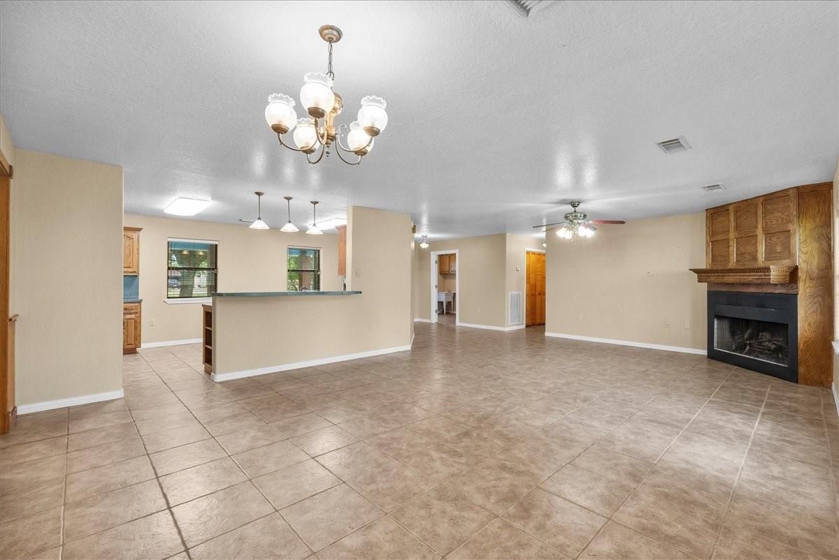 Chandelier, Empty room, Fireplace, Interior