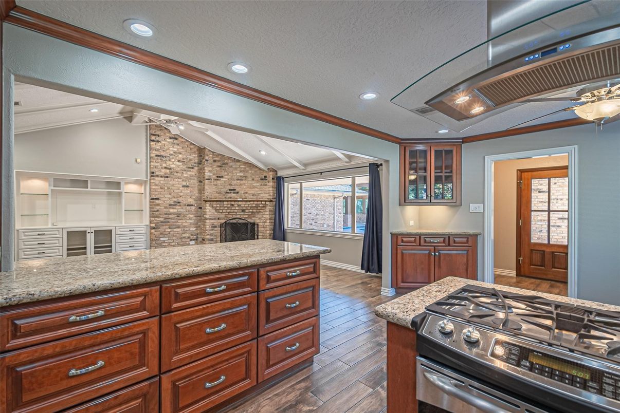 Fireplace, Interior, Kitchen, Recessed Lighting, Stone Walls, Wood Texture Flooring