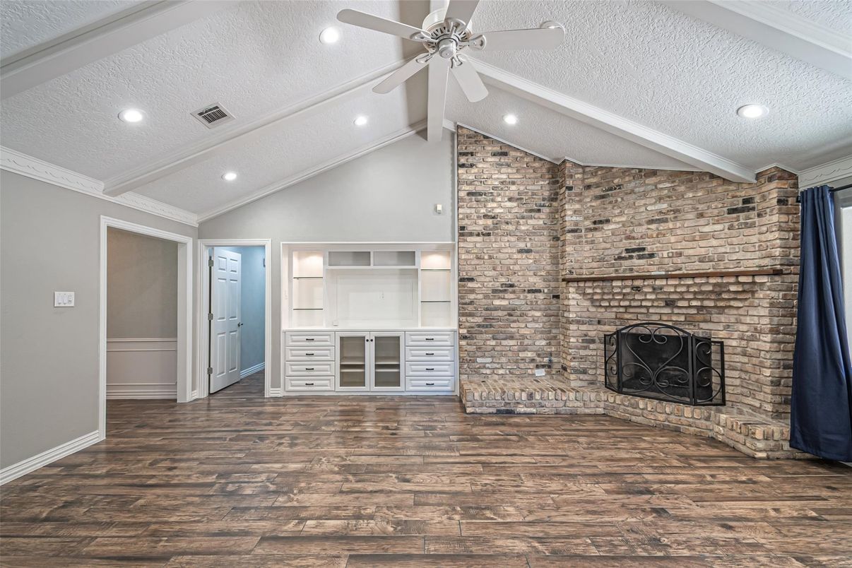 Empty room, Fireplace, Interior, Recessed Lighting, Stone Walls, Wood Texture Flooring