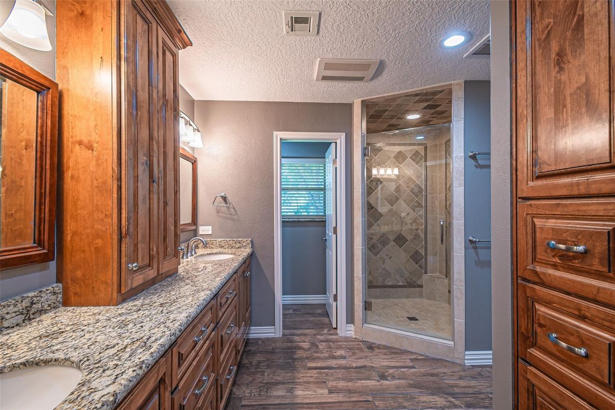 Bathroom, Dual Sink Vanities, Glass Shower, Interior, Recessed Lighting, Wood Texture Flooring