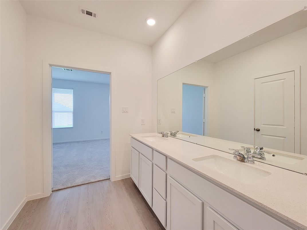 Bathroom, Dual Sink Vanities, Interior, Recessed Lighting, Wood Texture Flooring