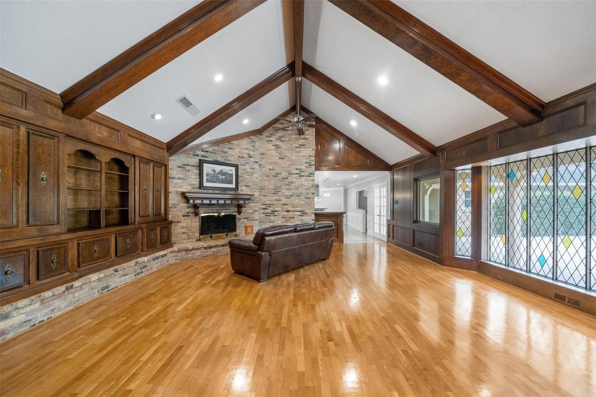 Empty room, Fireplace, Interior, Recessed Lighting, Stone Walls, Wooden Beams, Wood Texture Flooring