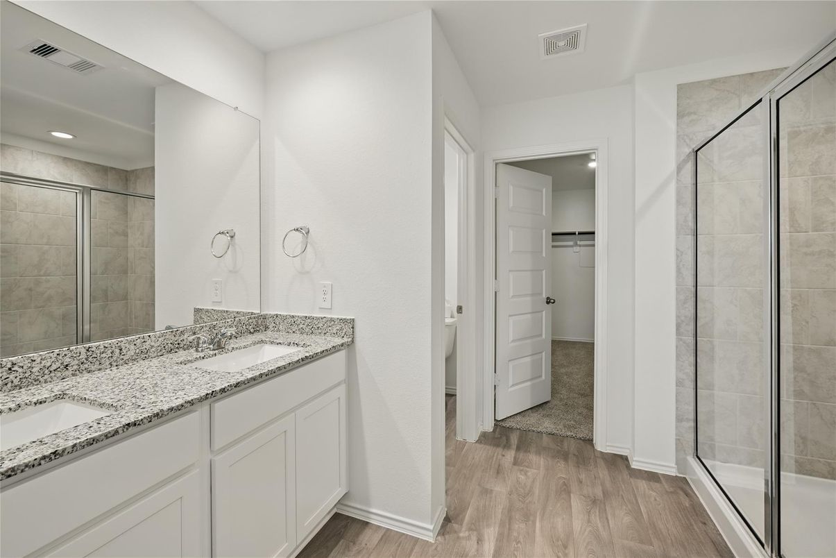 Bathroom, Dual Sink Vanities, Glass Shower, Interior, Recessed Lighting, Wood Texture Flooring
