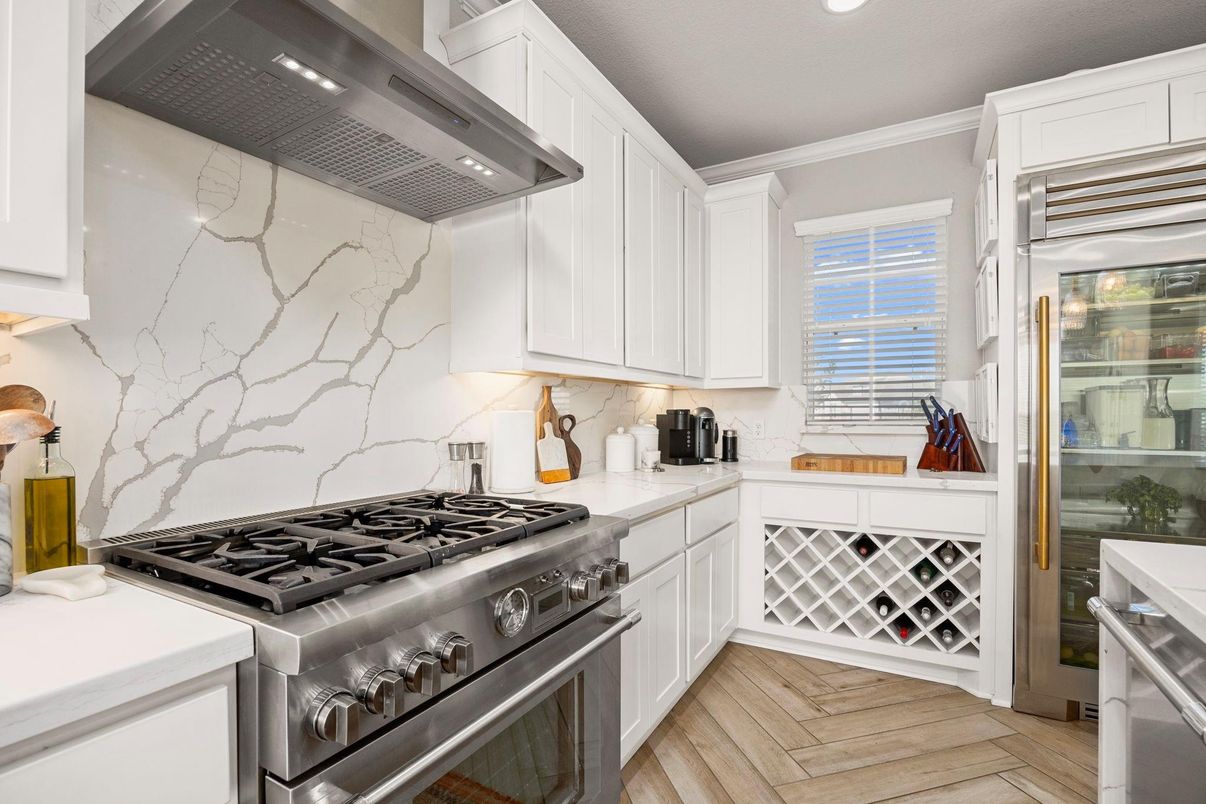 Interior, Kitchen, Marble Walls, Recessed Lighting, Stainless Steel Appliances, Wood Texture Flooring
