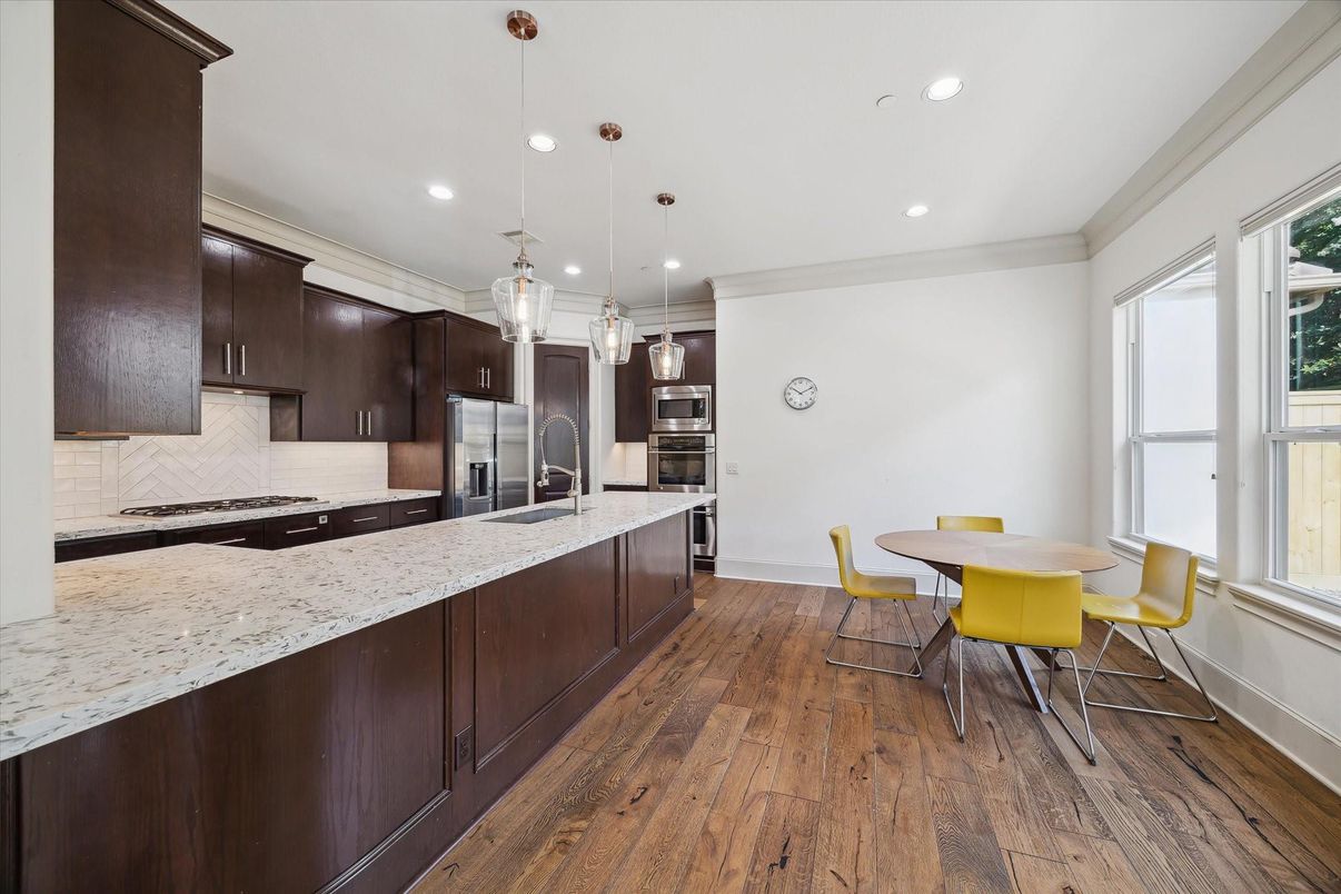 Dining room, Interior, Kitchen, Pendant Lights, Recessed Lighting, Stainless Steel Appliances, Wood Texture Flooring