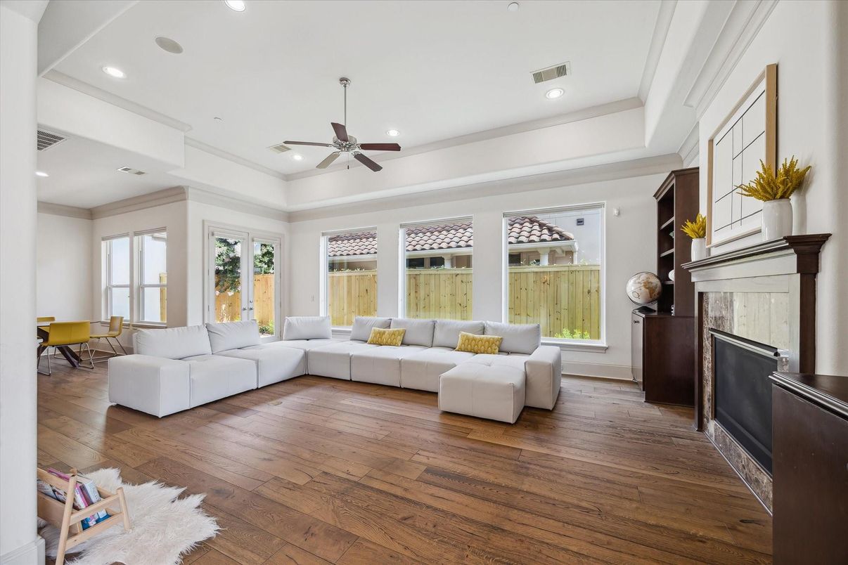 Dining room, Fireplace, Interior, Living room, Recessed Lighting, Wood Texture Flooring