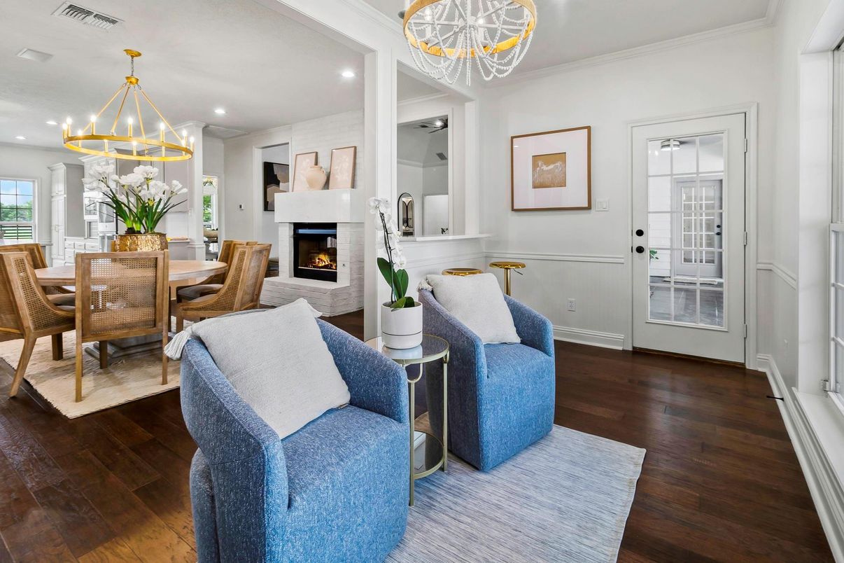 Chandelier, Dining room, Fireplace, Interior, Living room, Pendant Lights, Recessed Lighting, Wood Texture Flooring