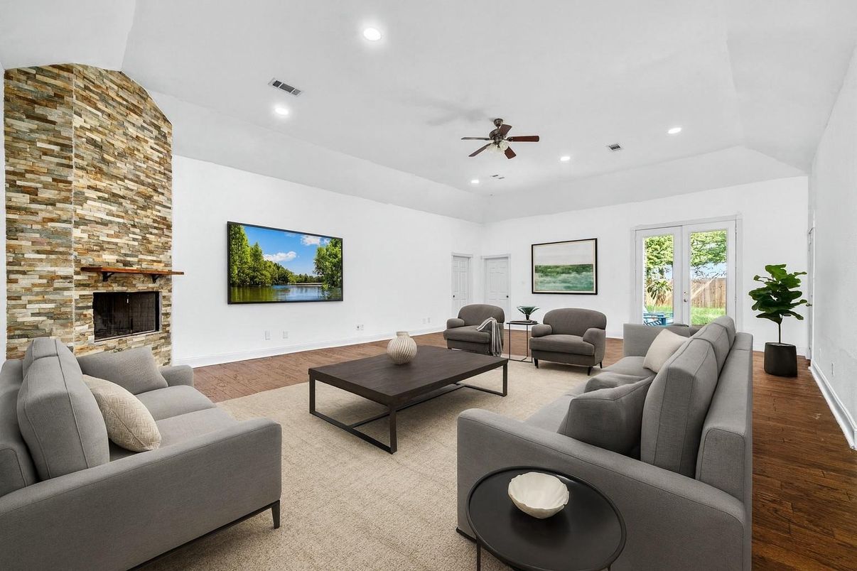 Fireplace, Interior, Living room, Recessed Lighting, Stone Walls, Wood Texture Flooring