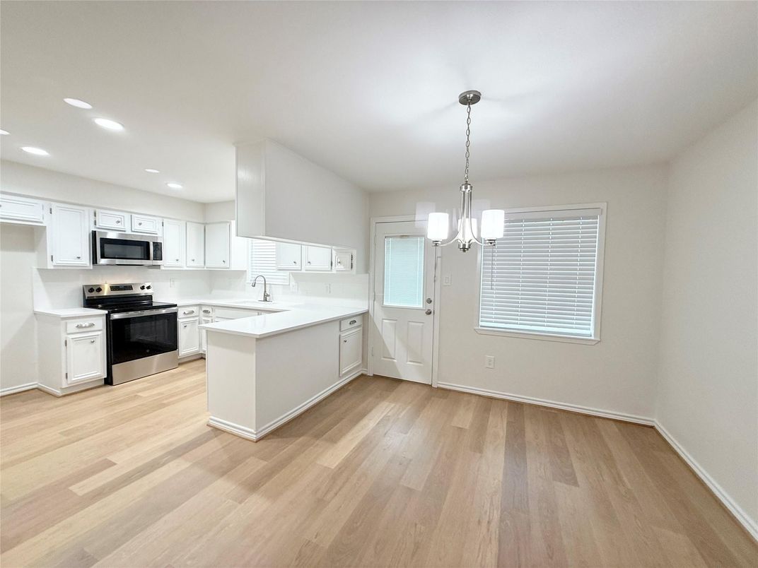 Interior, Kitchen, Pendant Lights, Recessed Lighting, Stainless Steel Appliances, Wood Texture Flooring