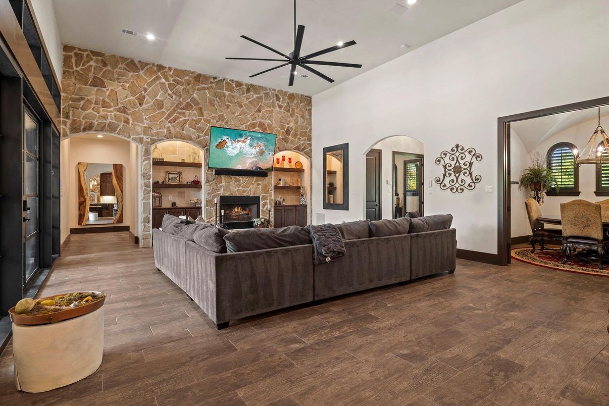 Dining room, Fireplace, Interior, Living room, Pendant Lights, Recessed Lighting, Stone Walls, Wood Texture Flooring