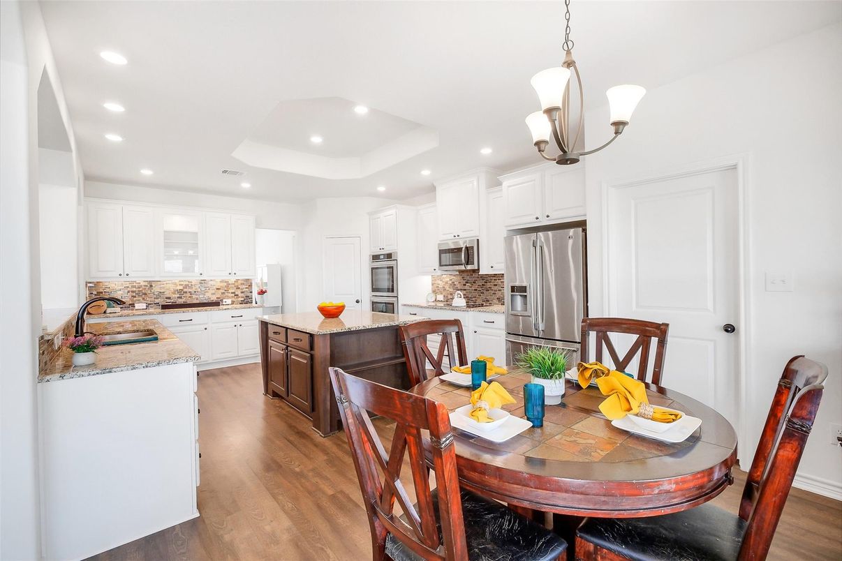 Dining room, Interior, Kitchen, Pendant Lights, Recessed Lighting, Stainless Steel Appliances, Wood Texture Flooring