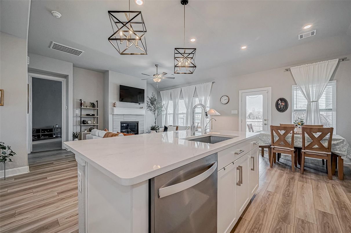 Dining room, Fireplace, Interior, Kitchen, Pendant Lights, Recessed Lighting, Wood Texture Flooring