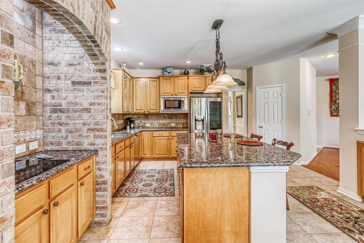 Interior, Kitchen, Pendant Lights, Recessed Lighting, Stainless Steel Appliances, Stone Walls, Wood Texture Flooring