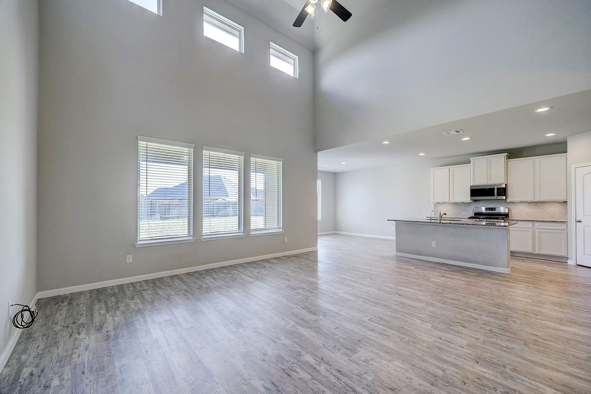 Empty room, Interior, Kitchen, Recessed Lighting, Stainless Steel Appliances, Wood Texture Flooring