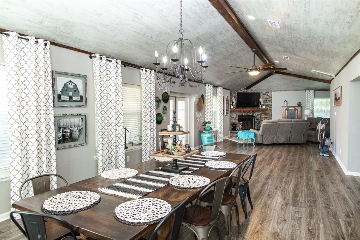 Chandelier, Dining room, Fireplace, Interior, Living room, Stone Walls, Wooden Beams, Wood Texture Flooring
