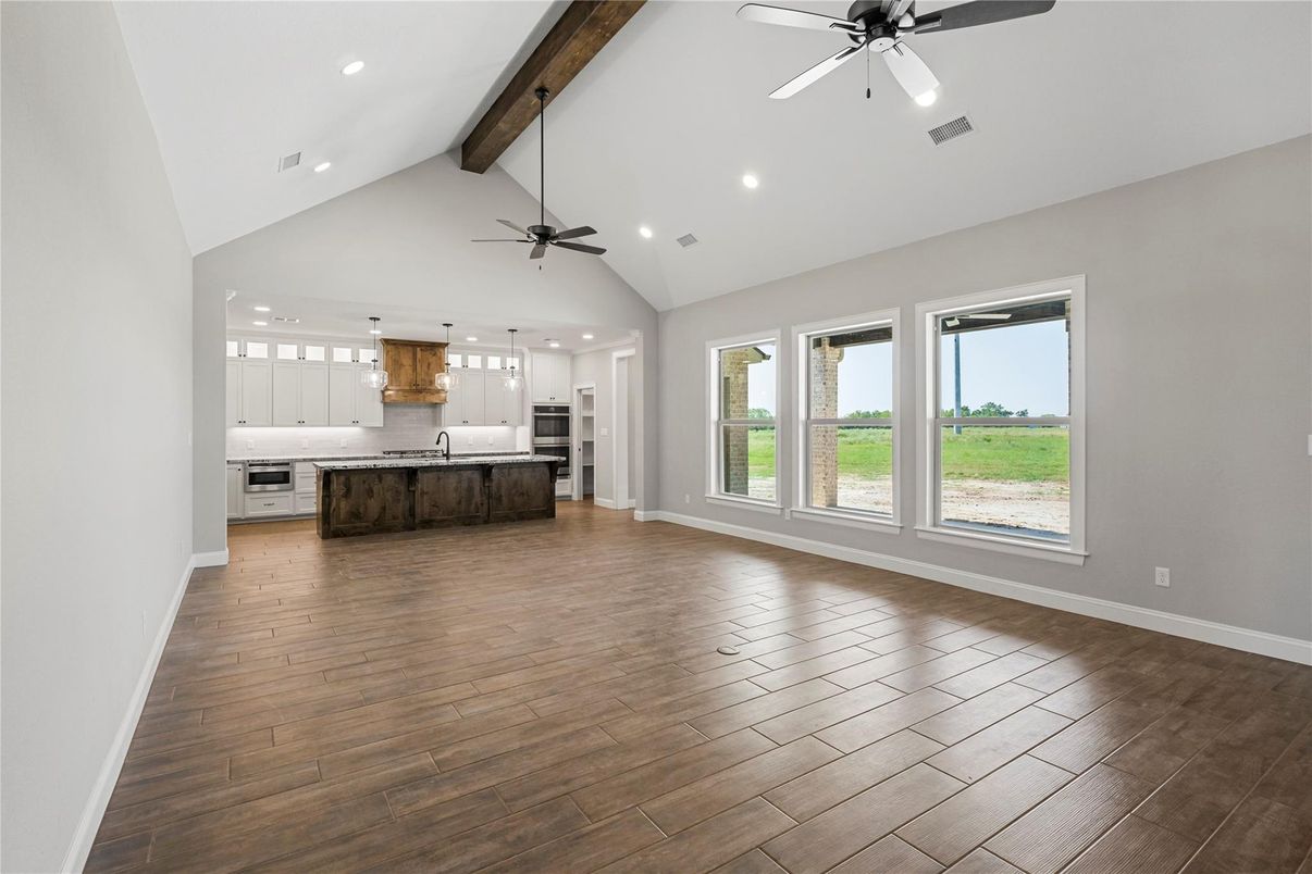 Empty room, Interior, Kitchen, Pendant Lights, Recessed Lighting, Stainless Steel Appliances, Wooden Beams, Wood Texture Flooring