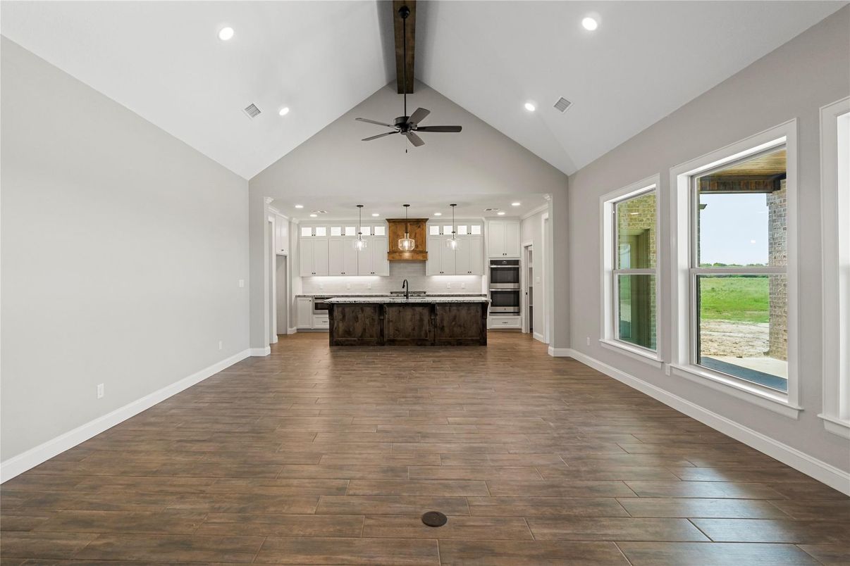 Empty room, Interior, Kitchen, Pendant Lights, Recessed Lighting, Stainless Steel Appliances, Wood Texture Flooring