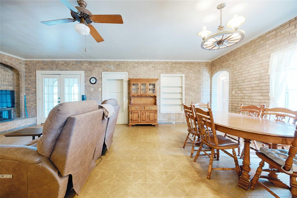 Chandelier, Dining room, Fireplace, Interior, Living room, Stone Walls