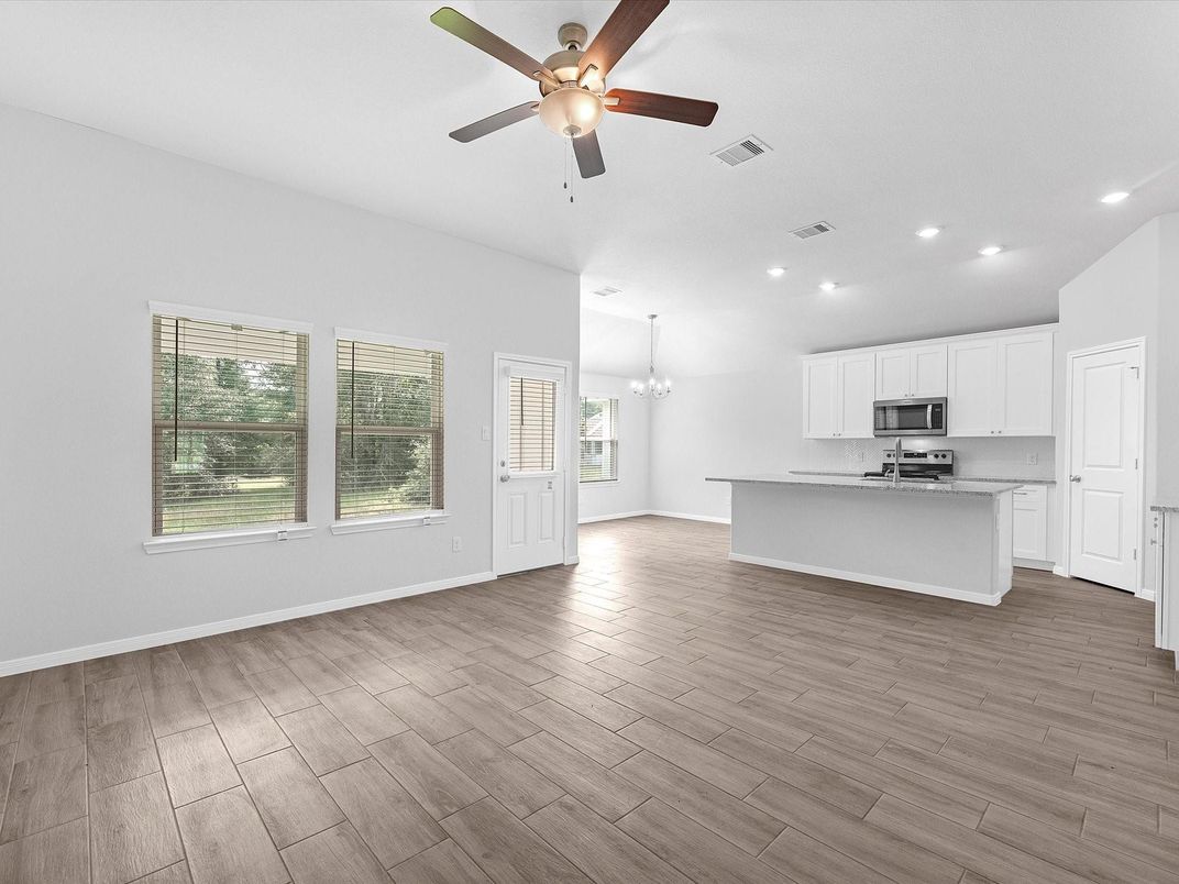 Chandelier, Empty room, Interior, Kitchen, Recessed Lighting, Stainless Steel Appliances, Wood Texture Flooring