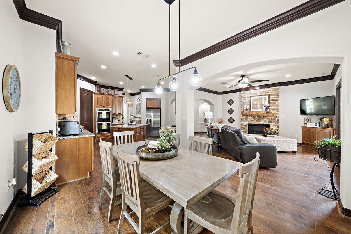 Dining room, Fireplace, Interior, Kitchen, Living room, Pendant Lights, Recessed Lighting, Stainless Steel Appliances, Stone Walls, Wood Texture Flooring