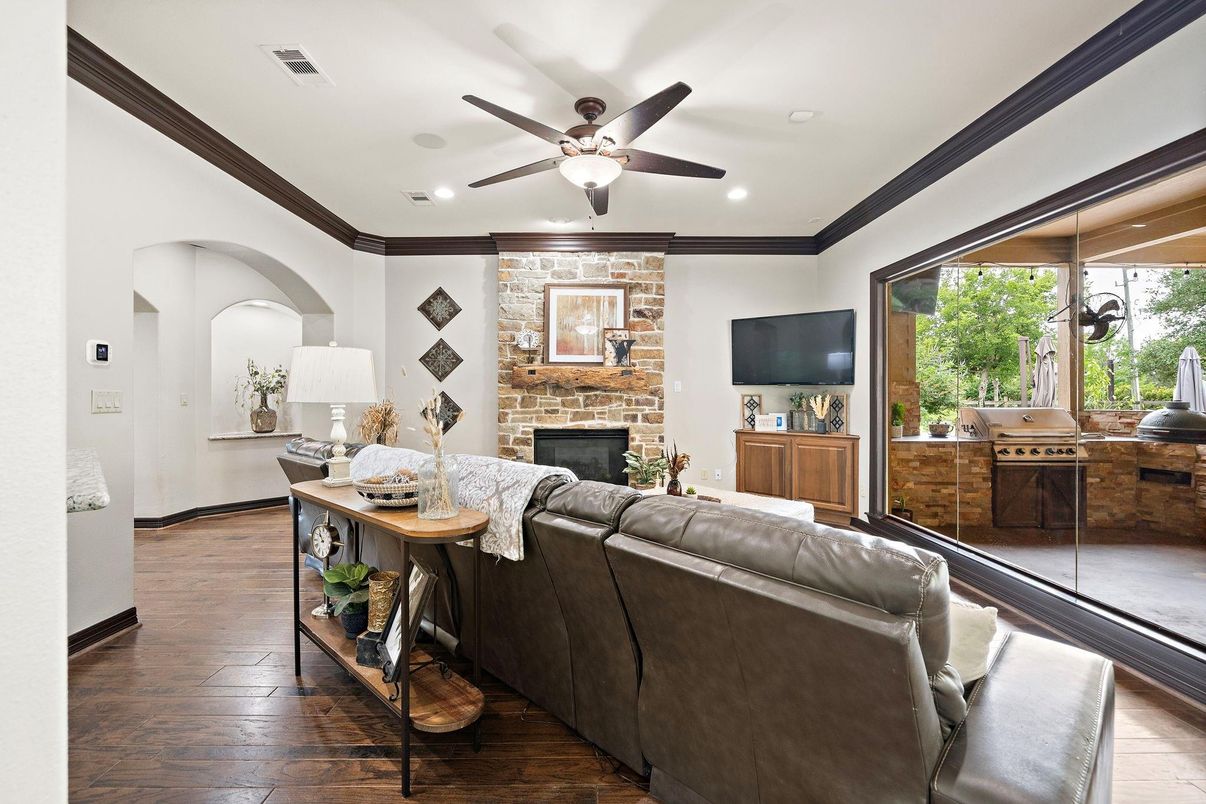 Fireplace, Interior, Living room, Recessed Lighting, Stone Walls, Wood Texture Flooring
