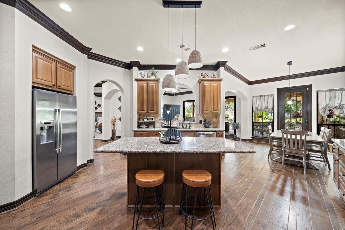 Dining room, Interior, Kitchen, Pendant Lights, Recessed Lighting, Stainless Steel Appliances, Wood Texture Flooring