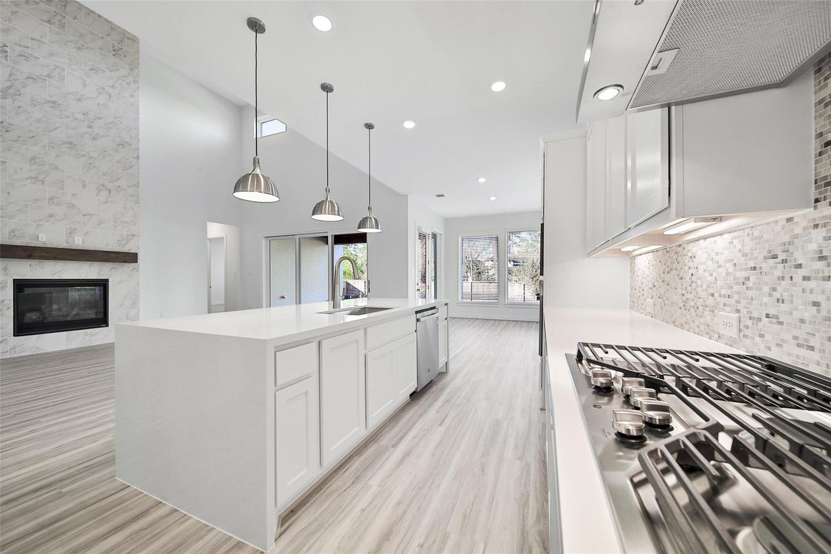 Fireplace, Interior, Kitchen, Pendant Lights, Recessed Lighting, Stainless Steel Appliances, Wood Texture Flooring