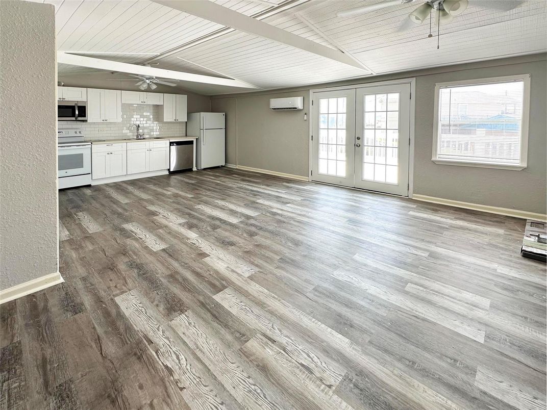 Empty room, Interior, Kitchen, Stainless Steel Appliances, Wood Texture Flooring