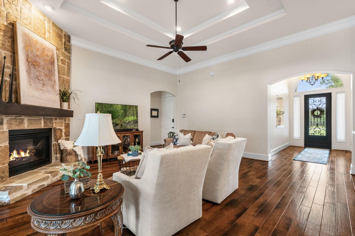 Chandelier, Fireplace, Interior, Living room, Recessed Lighting, Stone Walls, Wood Texture Flooring