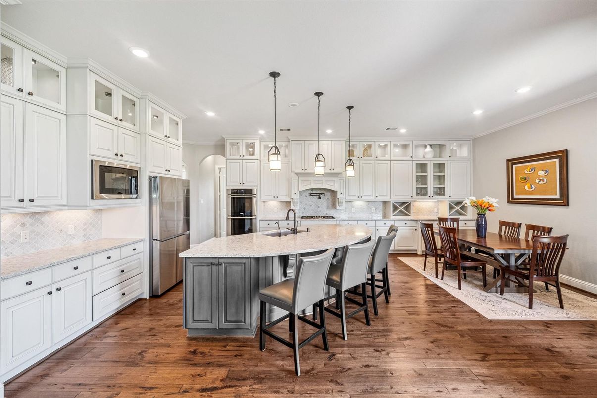 Dining room, Interior, Kitchen, Pendant Lights, Recessed Lighting, Stainless Steel Appliances, Wood Texture Flooring