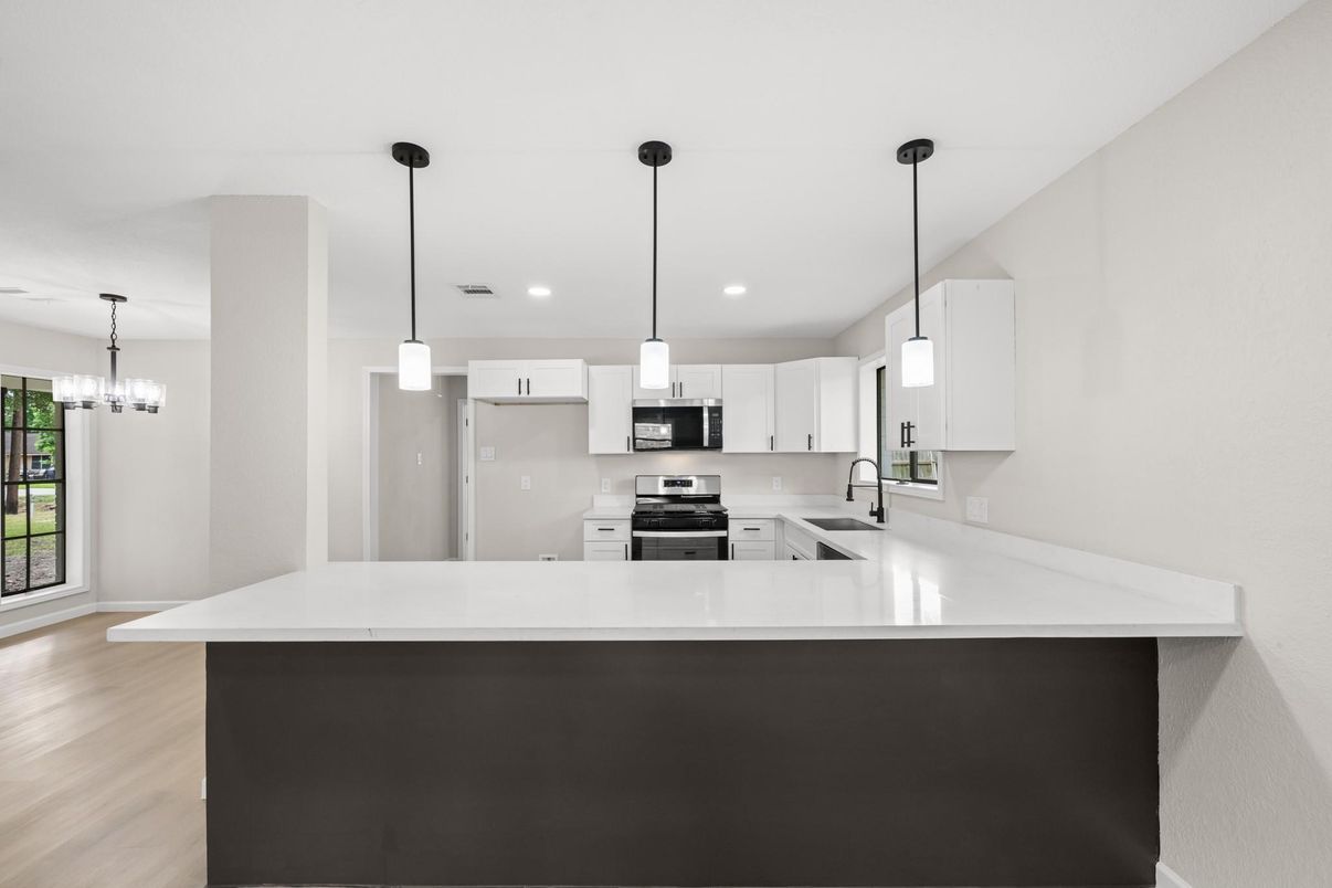 Chandelier, Interior, Kitchen, Pendant Lights, Recessed Lighting, Stainless Steel Appliances, Wood Texture Flooring